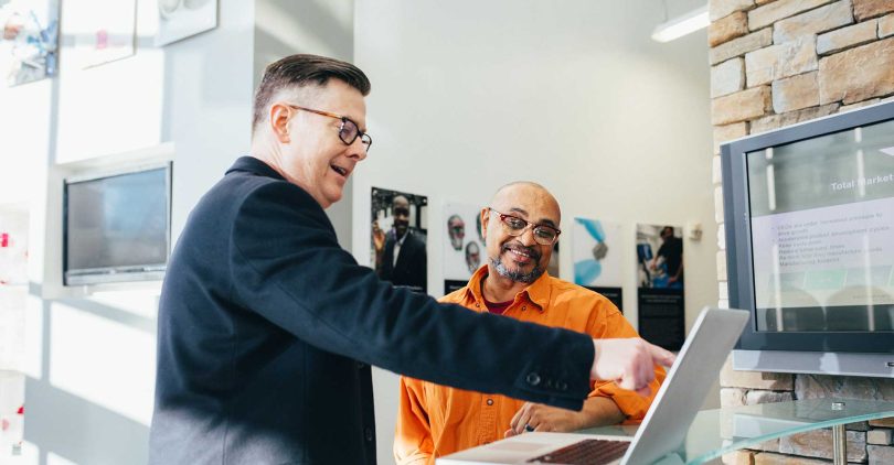 Corporate leaders planning growth with digital tools and charts